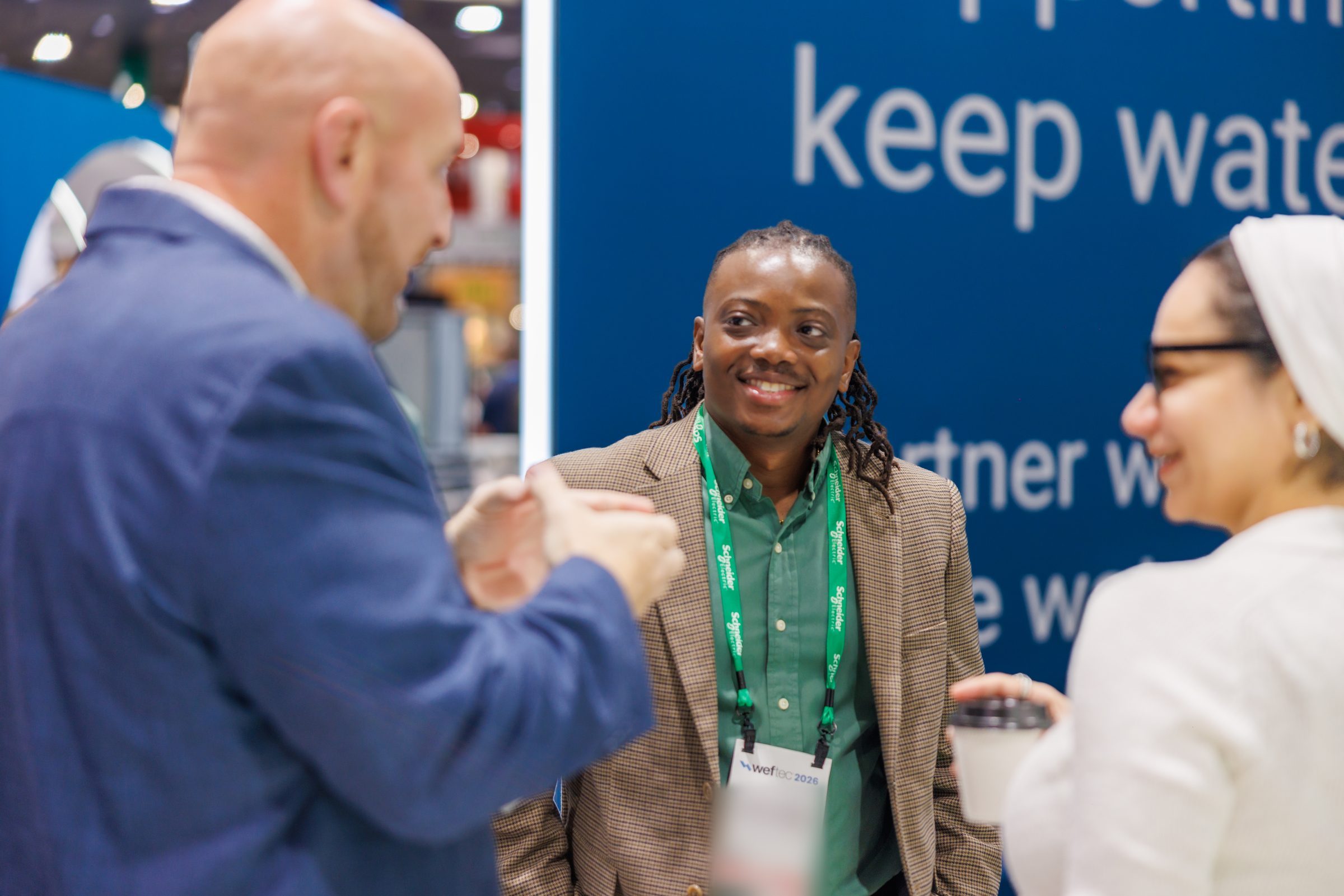 Conversation at the Schneider Electric booth at WEFTEC 2026
